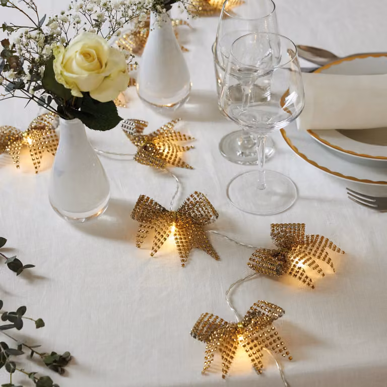 Ghirlanda luminosa decorativa a batteria «Bowie», 20 fiocchi in tessuto dorato, LED, timer, luce bianco caldo, L 200 cm